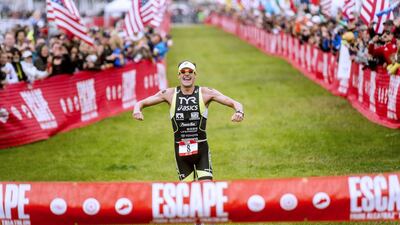 Andy Potts celebrates as he wins the 34th annual Escape from Alcatraz Triathlon in San Francisco, California on Sunday. Noah Berger / Reuters / June 1, 2014