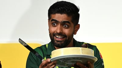 Pakistan captain Babar Azam holds up his birthday cake at a press conference in Melbourne on Saturday. AFP