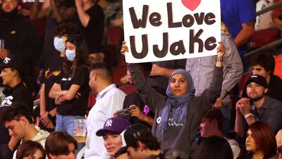 A fan holds up a sign reading "We Love U Jake" during the cruiserweight bout between Jake Paul and Anderson Silva. AFP