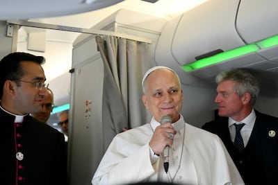 Pope Leo XIV addresses journalists during the flight heading to Algiers. Reuters