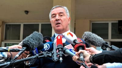 The presidential candidate of the ruling Democratic party of Socialist Milo Djukanovic addresses the media after casting his vote. AFP