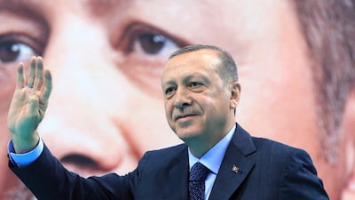 Turkey's President Recep Tayyip Erdogan waves to supporters of his ruling Justice and Development Party (AKP), at a rally in Elazig, eastern Turkey on January 13 2018. Mr Erdogan has said Turkey will oust Kurdish militias from Afrin, northern Syria, as the military shelled the area from across the border. Turkey considers the YPG a terror group and an extension of the Kurdish insurgency within its own borders. AP