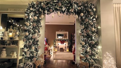 New to the house this year is a giant arch, purchased second-hand and decorated by the family