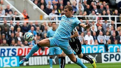 Manchester City's Bosnian striker Edin Dzeko controls the ball as he runs through on goal during the English Premier League football match between Newcastle United and Manchester City at St James' Park in Newcastle-upon-Tyne, north east England on August 17, 2014. AFP PHOTO / IAN MACNICOL