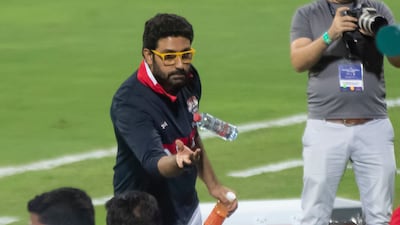 Abhishek Bachchan giving water to his team mates.