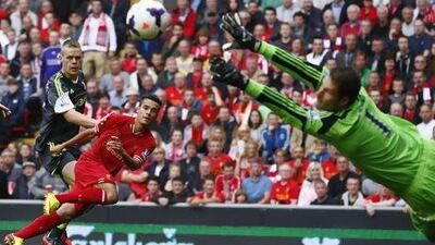 Stoke City goalkeeper Asmir Begovic makes a save from Liverpool's Philippe Coutinho.
