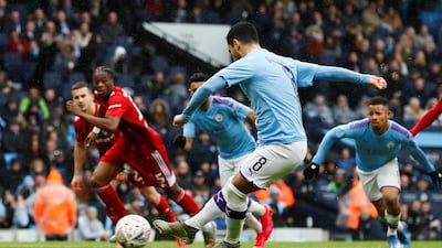 Ilkay Gundogan scores from the spot. Reuters