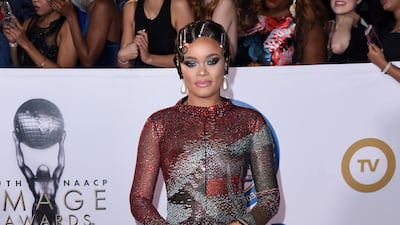 Rise Up singer Andra Day's Giorgio Armani gown has a painterly and vintage quality, and yet the singer-songwriter still looks very much of this millennium. AP / Richard Shotwell