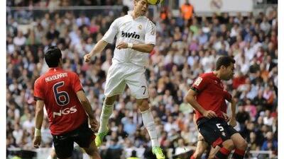 Cristiano Ronaldo’s 12th hat-trick at Real Madrid ensured his team finished off Osasuna convincingly after a tight first half.