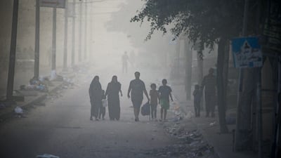 Residents flee from Al Shatea refugee camp during combat between the Israeli army and Hamas in Gaza city. EPA