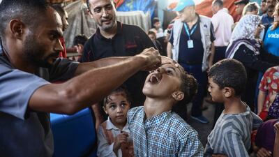 Palestinian children receive a polio vaccination in Deir Al Balah, in central Gaza, on Monday. The second round of the campaign aims to vaccinate 591,700 children in the enclave. AFP