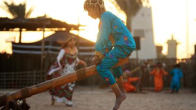 Children play while dressed in traditional Emirati clothes. Ravindranath K / The National