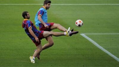 Javier Mascherano, left, and Gerard Pique battle for the ball during Barcelona's final training session at Camp Nou before they left for London last night. The two could be paired together in the heart of the defence for Saturday's Champions League final against Manchester United at Wembley Stadium.