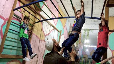 Syrian children play in the underground playground built to protect them from shelling. More than 280,000 people have been killed and millions have been displaces since Syria’s conflict broke out in March 2011.