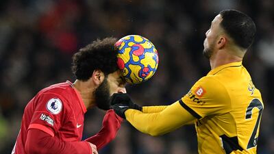 Liverpool attackerMohamed Salah heads the ball. AFP