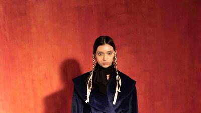 A deep blue coat by Osman Yousefzada for autumn / winter 2021. Courtesy Osman Yousefzada