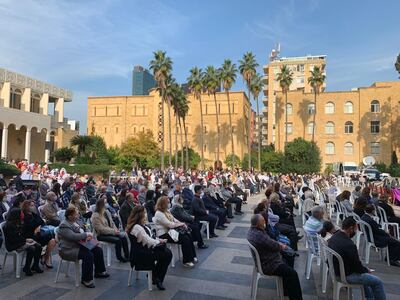 Lebanese-Armenians sit outside during a Christmas service. Mahmoud Rida/The National
