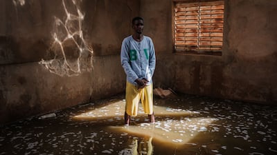 Teacher Suleyman Ba stands in a classroom of the Ecole de Diogel. Floods along the Senegal River have affected more than 55,000 people, leaving many villages under water and over 1,000 hectares of farm land submerged. AFP