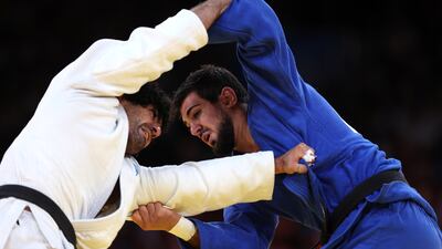 Theodoros Tselidis of Team Greece and Aram Grigorian of Team UAE grapple in the repechage round. Getty Images