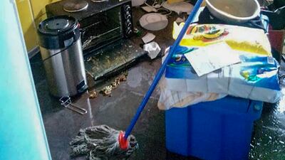 Debris lies strewn across the floor in the kitchen of Renagi Ravu's house in the town of Kainantu, following the quake.
