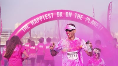 An estimated 12,000 runners, joggers and walkers of all ages, shapes and sizes turned out for the Colour Run Dubai. Clint McLean for The National