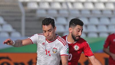 UAE's Caio Canedo and Rabih Ataya battle for the ball. AFP
