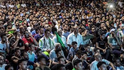 Palestinians supporters of the Algerian side watch the action in Gaza City. EPA