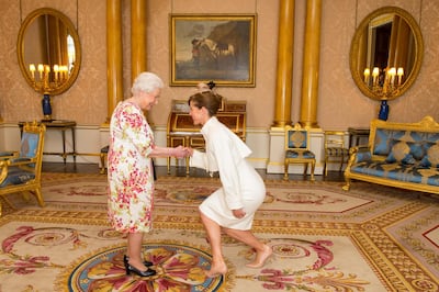 Darcey Bussell meets Queen Elizabeth II in Buckingham Palace in 2016. Getty