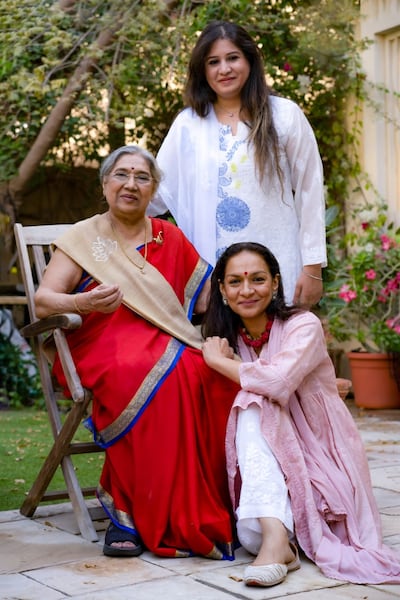 Hansaji Yogendra with Sneha Arora, standing, and Kavita Mathur who work alongside her at The Yoga Institute