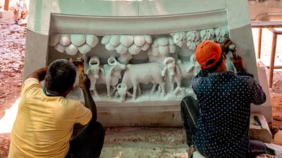 Marble pillars are divided into four sections and then refitted at the temple site in Abu Dhabi. Photo: Baps Hindu Mandir