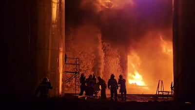 A Russian oil depot burns after an attack by Ukraine. The war is in its fourth year. AP