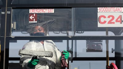 A public bus is sanitised after the morning peak period in Cape Town, South Africa. Ratings agency S&P Global said it expects South Africa's economy to contract 4.5 per cent this year as lockdown measures hit an already fragile economy. AP Photo