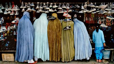 'Afghan Women at Shoe Store. Kabul, Afghanistan, 1992'.