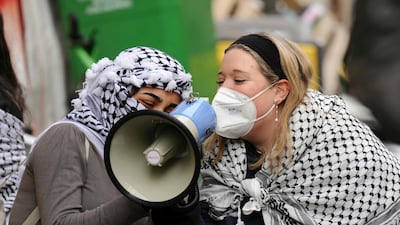 Demonstrators speak into a megaphone during the occupation. AFP