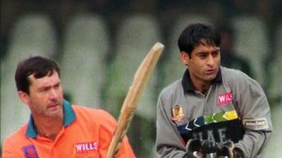 On March 1, 1996, Peter Cantrell, left, of the Netherlands scored 47 in a total of 216 while Imtiaz Abbasi looks on in Lahore, Pakistan. Zafar Ahmed / AP Photo