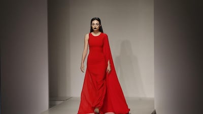 Emirati model Rafeea Al Hajsi, in a gown by Lebanese designer Aiisha Ramadan, at Huawei Arab Fashion Week. Karim Sahib / AFP