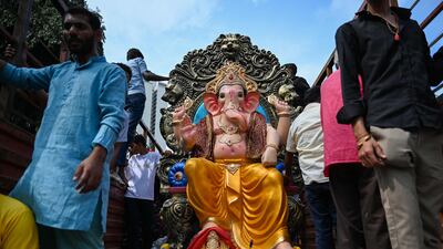 Another idol of the Hindu deity is paraded on a float on the first day of Ganesh Chaturthi in Mumbai. AFP