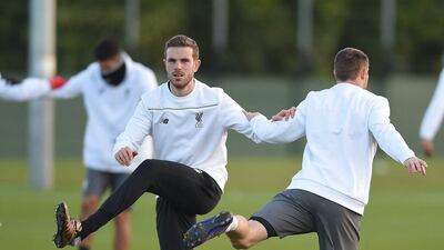 epa05178829 Liverpool's player Jordan Henderson (L) attends a training session at Melwood training facility in Liverpool, Britain, 24 February 2016. Liverpool FC play FC Augsburg at Anfield on the 25 February 2016 in an UEFA Europa League round of 32 match. EPA/PETER POWELL .