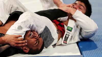 Murafis Ismailov, right, takes on Sultan Khamis Alameri in the 81kg final.