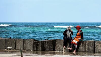 Women relax on a popular beach in the city of Alexandria, Egypt. AFP