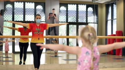 Children take part in a 'tumble tots' class with coach Melisa Prior. Chris Whiteoak / The National