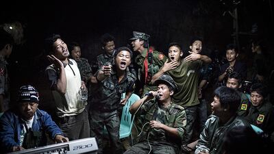 1st prize, Daily Life Single: Kachin Independence Army fighters celebrate at a funeral of one of their commanders who died the day before, in Burma. Julius Schrank, De Volkskrant / AP Photo