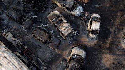 Gutted vehicles at a body shop, after the property was burnt by the Smokehouse Creek fire, in Canadian, Texas. AP