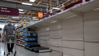 Empty shelves at a Sainsbury’s supermarket in London. A similar scene has unfolded across much of Britain as a shortage of lorry drivers disrupted supply chains and rising energy prices stalled production of carbon dioxide, a gas critical to the production and transport of food. Photo: Getty