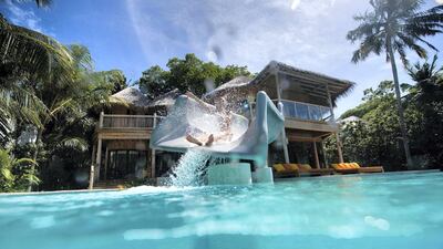 The water slide plunges straight into the Indian Ocean. Courtesy Soneva Fushi