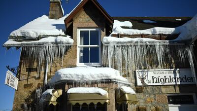 Icicles hang from the roof of a shop in Braemar. Getty Images