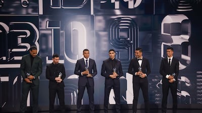 Virgil van Dijk of Liverpool, Lionel Messi, Kylian Mbappe and Achraf Hakimi of Paris Saint-Germain, Casemiro of Manchester United and Yassine Bounou of Sevilla with their Fifa Fifpro Men's World 11 Award on stage. EPA