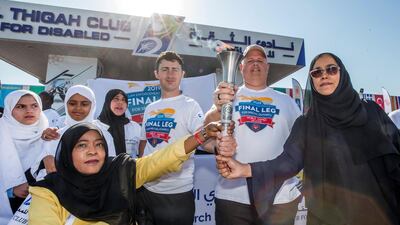 The Special Olympics Torch being held by officials and participants. Leslie Pableo for The National