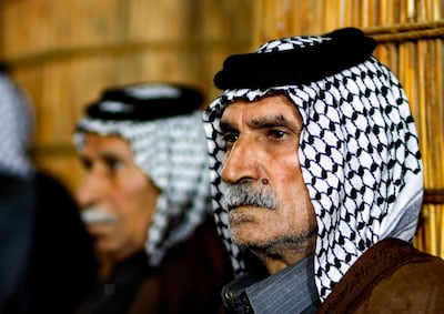 Members of an Iraqi tribe gather inside a straw tent in the town of Mishkhab, south of Najaf. AFP