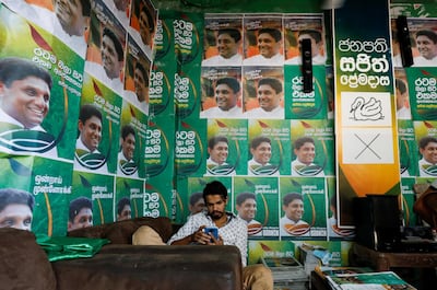 A supporter of Sajith Premadasa, Sri Lanka's presidential, candidate of the New Democratic Front alliance, sits inside a campaign office in Colombo. Reuters